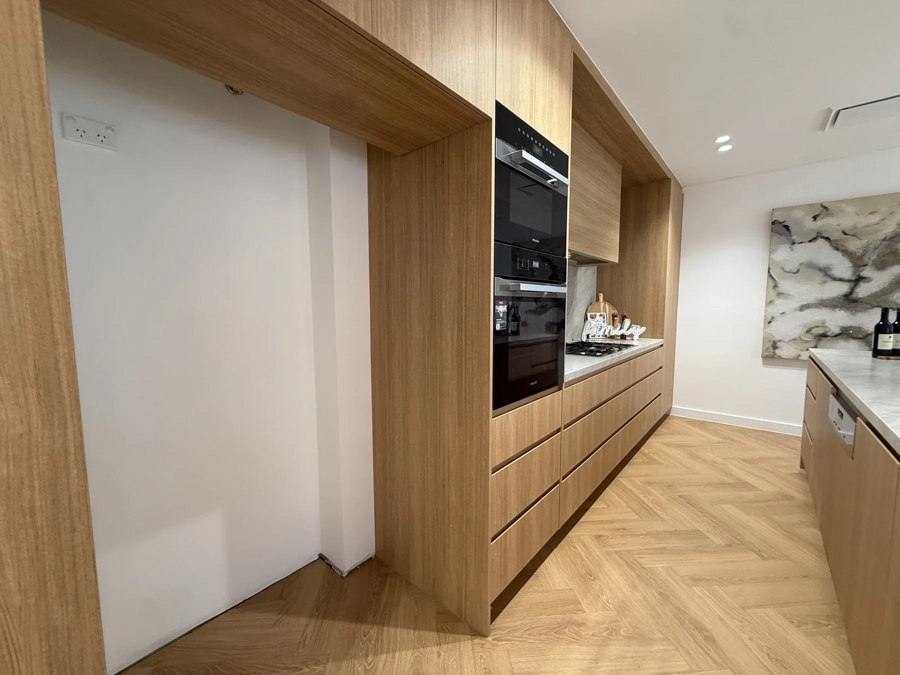 Epping kitchen corner view showing integrated rangehood and cabinetry layout