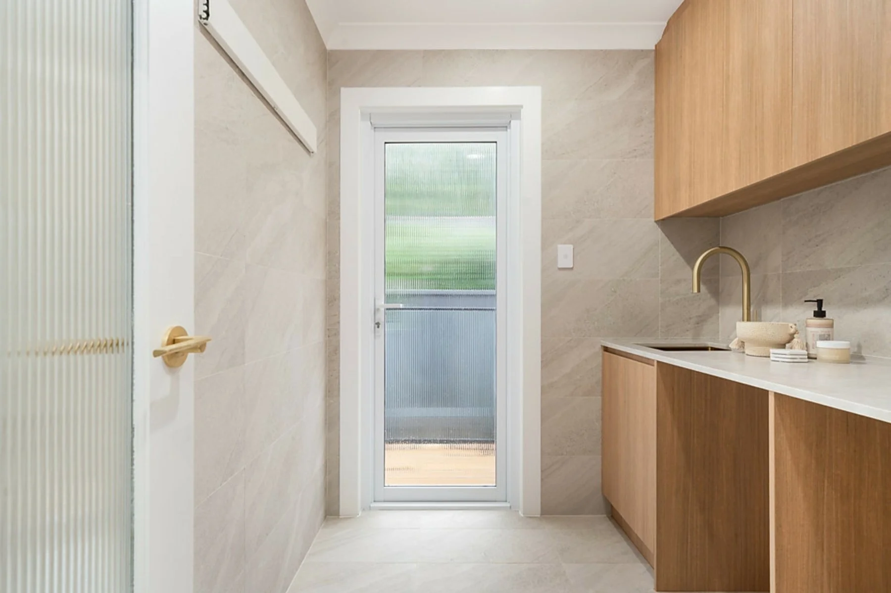 Epping laundry joinery detail with upper cabinetry and utility storage
