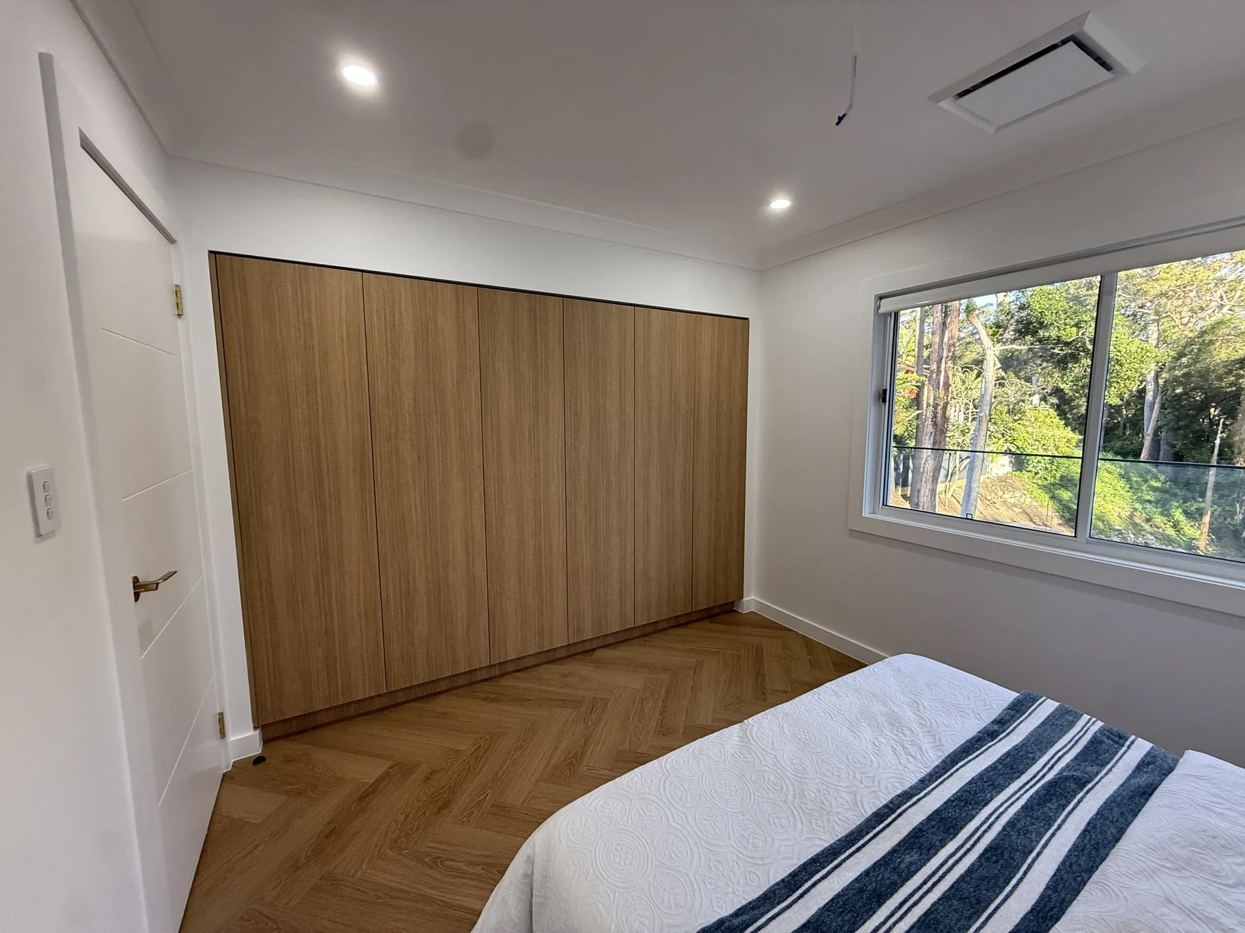 Epping bedroom with built-in wardrobe and matching timber joinery