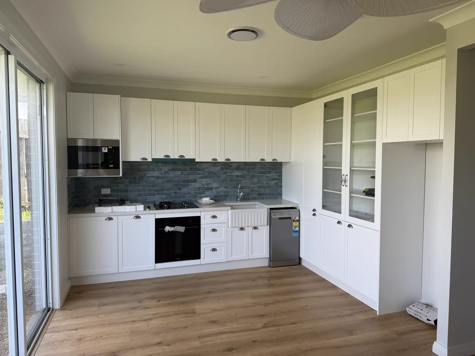 Kiama downstairs kitchen — wide angle showing full Hamptons kitchen layout