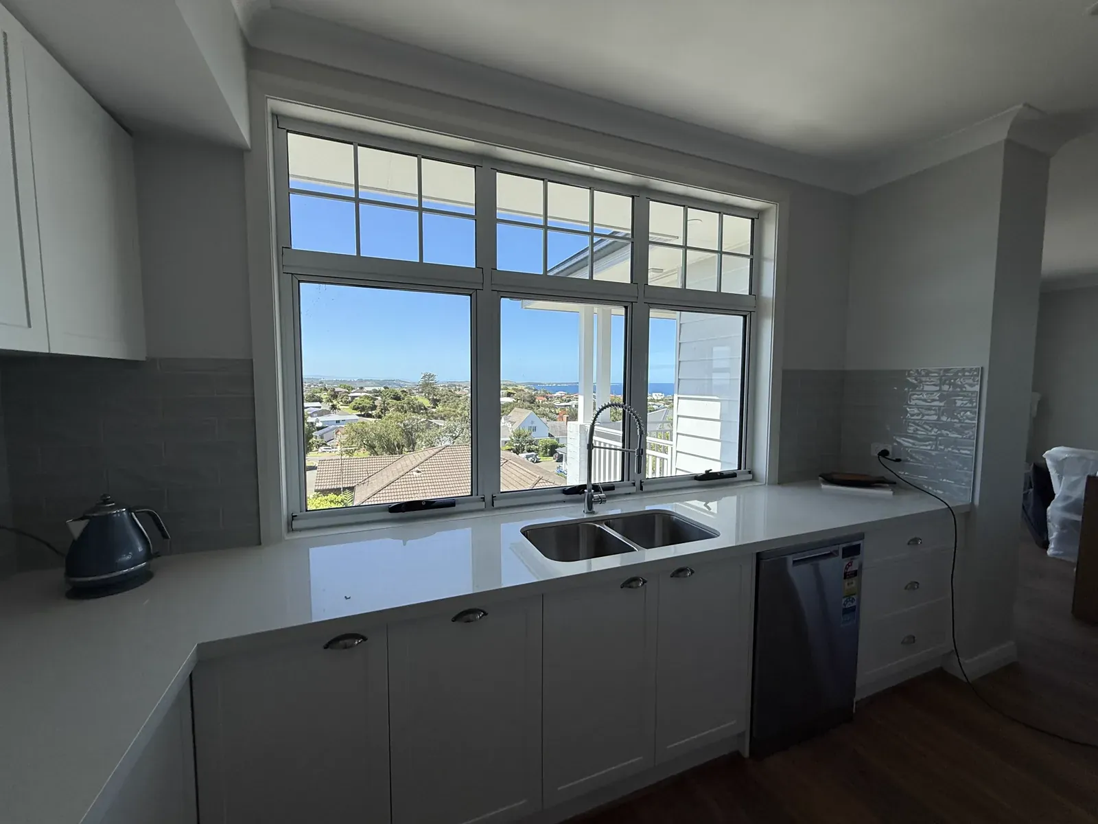 Kiama upstairs kitchen — second angle showing full cabinetry run