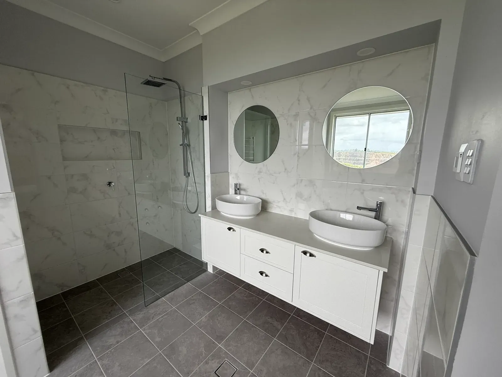 Kiama bathroom vanity in Dulux Vivid White — Hamptons renovation