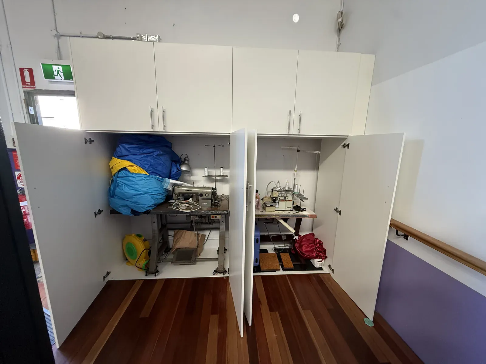 Concealed sewing station cabinet in Mascot with doors open