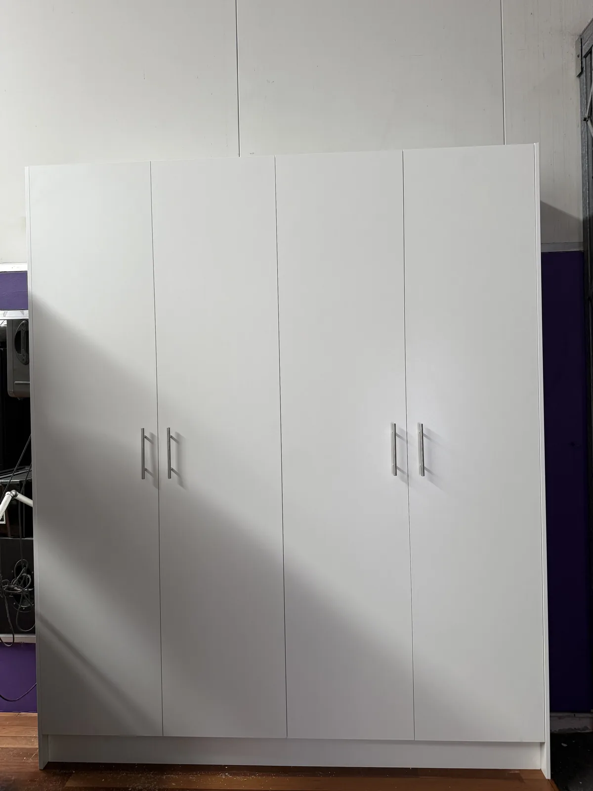 Detail of white drawer and door storage in a Mascot dance studio