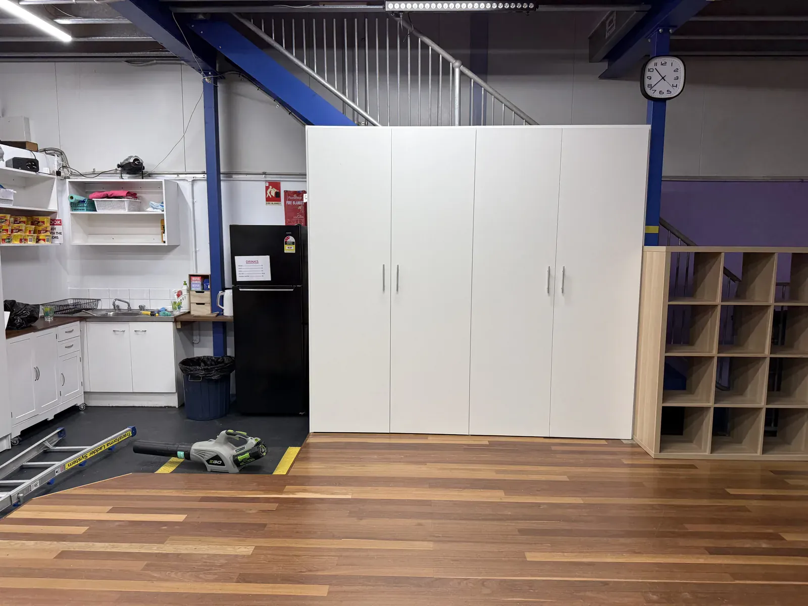 Floor-to-ceiling storage cabinetry on the studio floor in Mascot