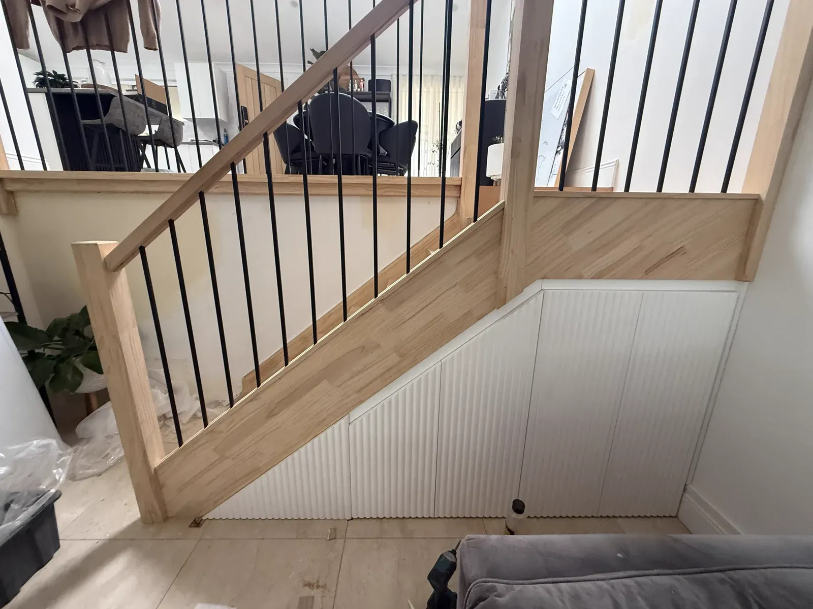 Neutral Bay understairs storage — fluted MDF panel fronts with push-to-open Blum drawers