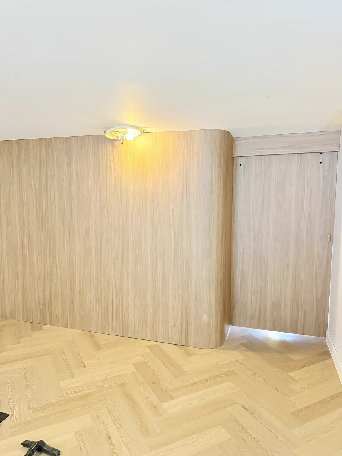 Neutral Bay walk-in wardrobe interior — hanging rails and shelving in Polytec Prime Oak