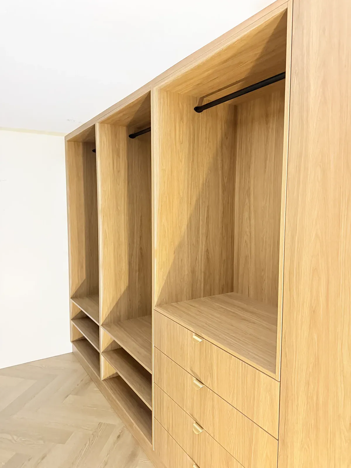 Neutral Bay walk-in wardrobe — Polytec Prime Oak drawer bank and hanging space