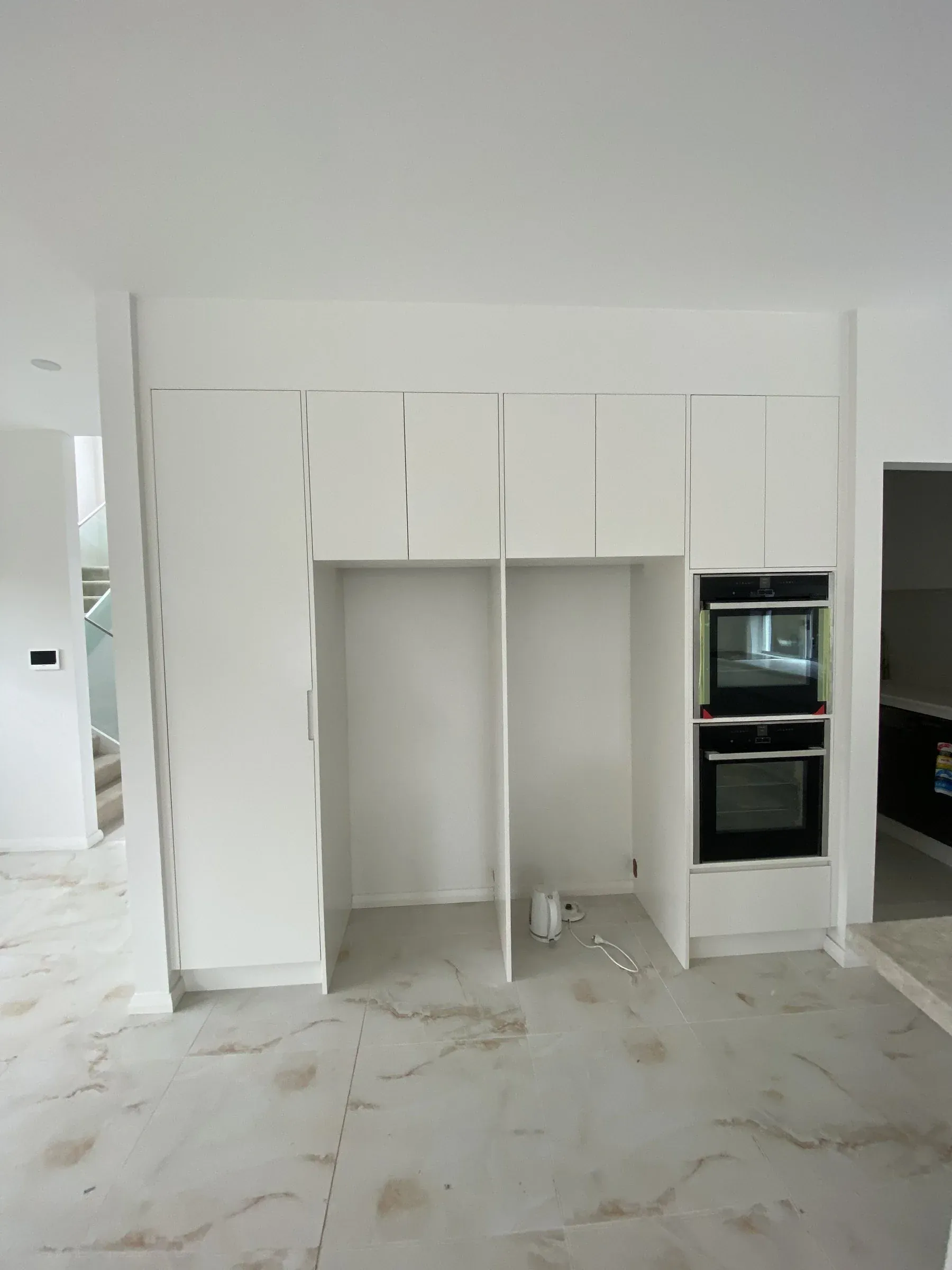 Monterey kitchen full-height oven stack and tall pantry cabinetry