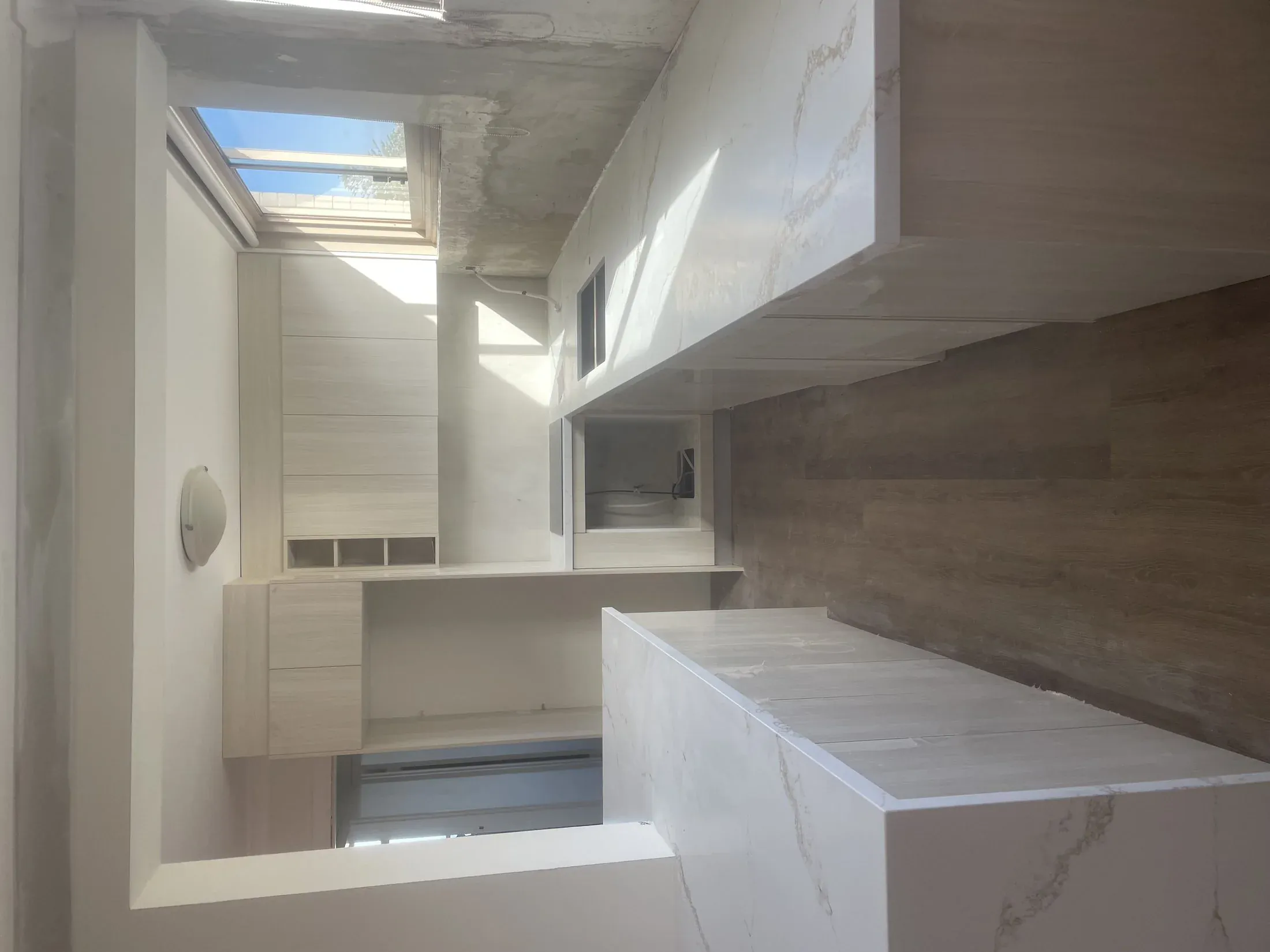 Vaucluse galley kitchen with skylight and white joinery