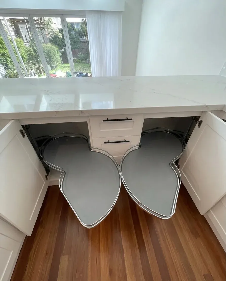 Blum LeMans corner pull-out fully extended showing the kidney shelves swung clear