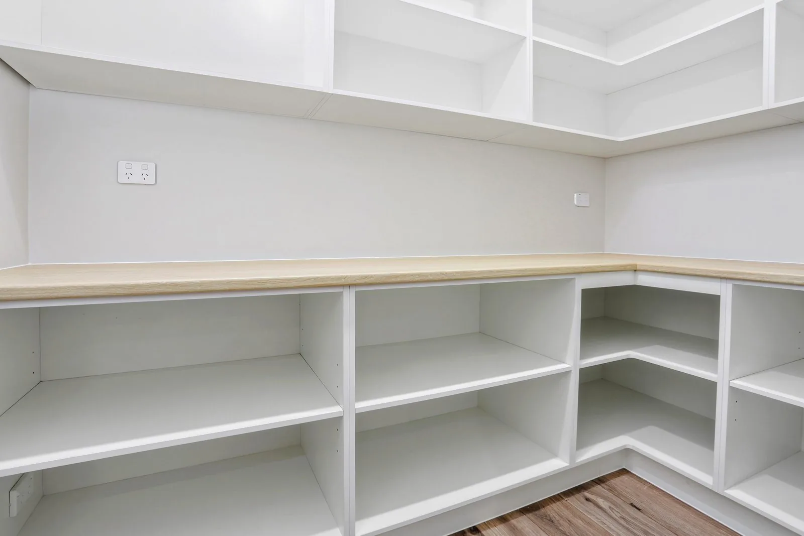Walk-in pantry with white open shelving and a Seasoned Oak Chalk benchtop in Stanhope Gardens