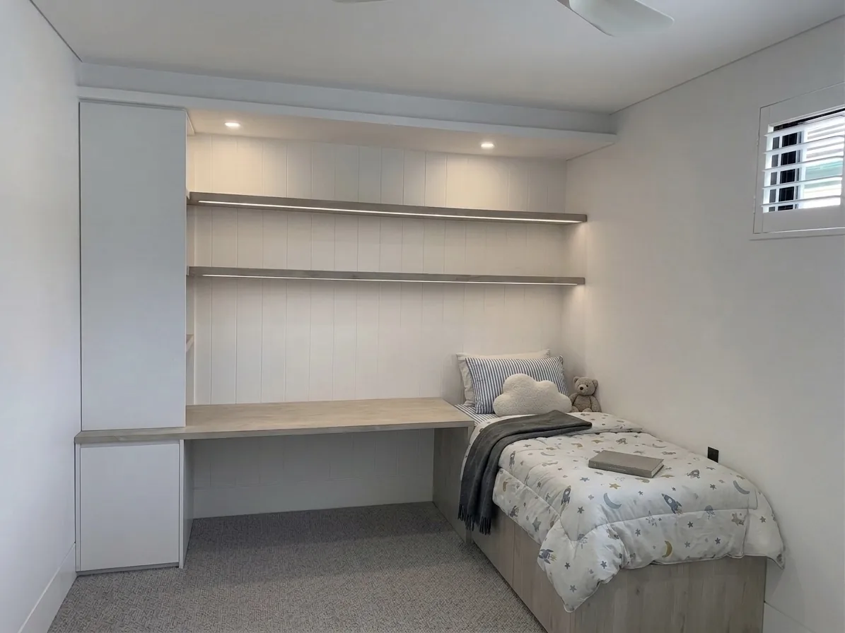 Kids room joinery in Angora Oak styled with a matching bed in place