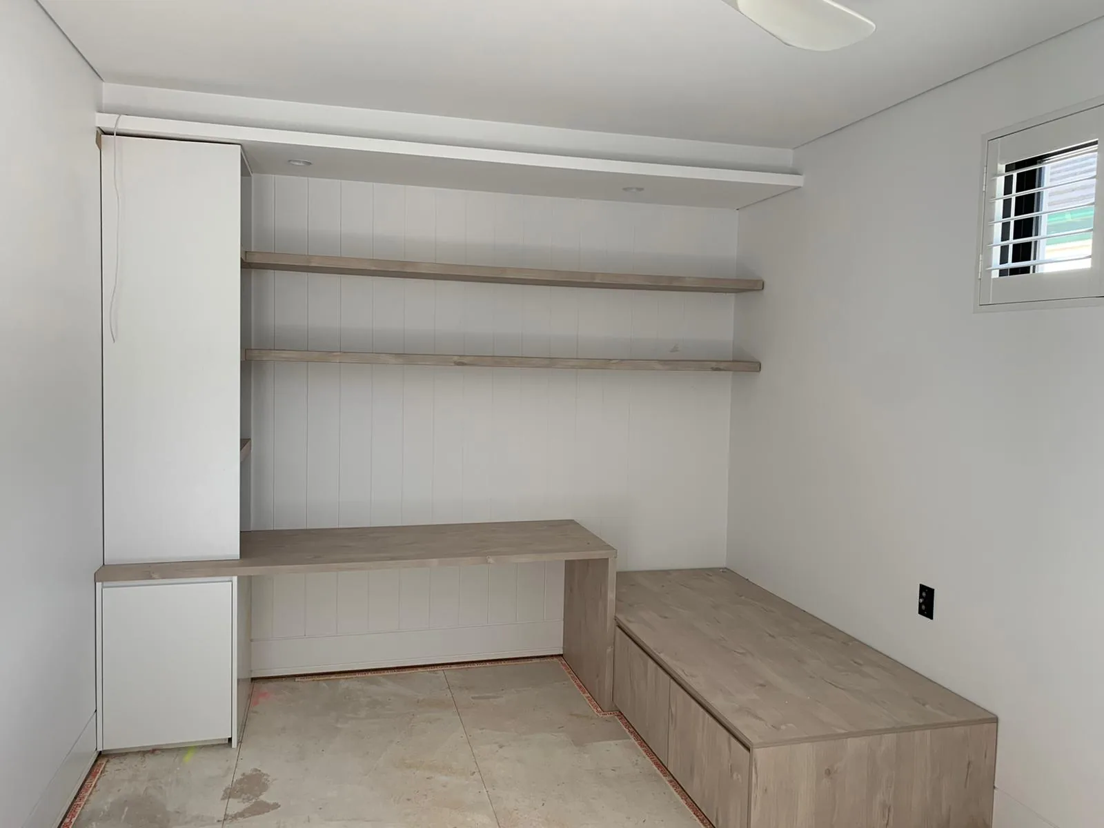 Open shelving and matching single bed in a Waverley kids room