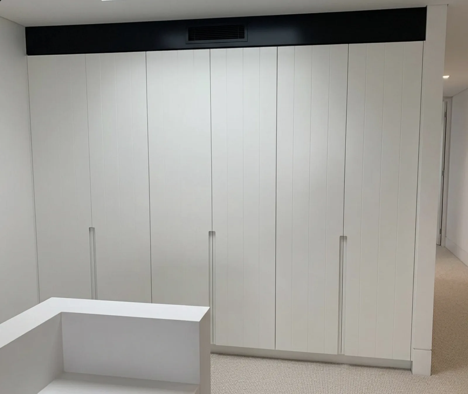 V-groove polyurethane doors with integrated J-pull on a Waverley upstairs walkway