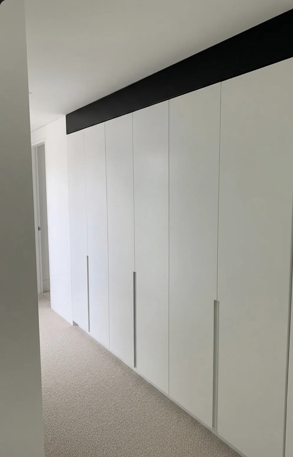 Linen cupboard finished in Dulux Vivid White polyurethane in Waverley