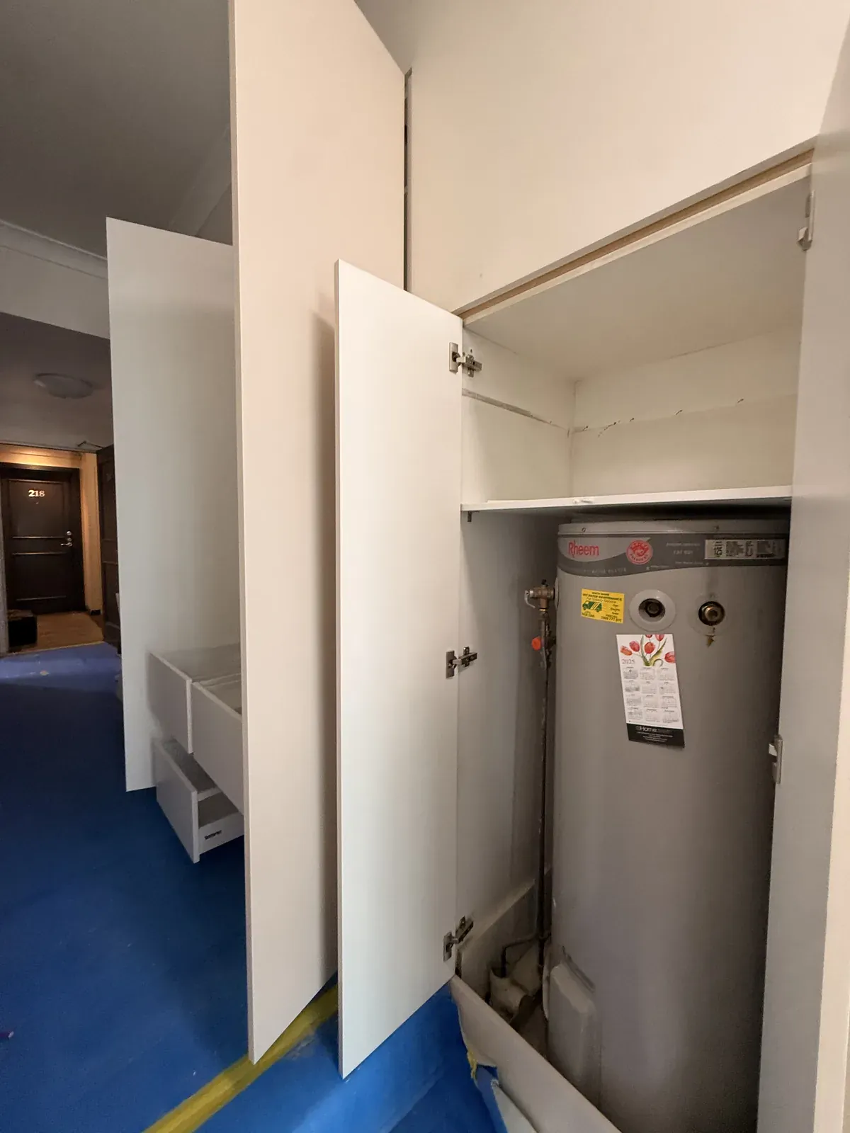 Cabinet housing the water unit in a Willoughby apartment