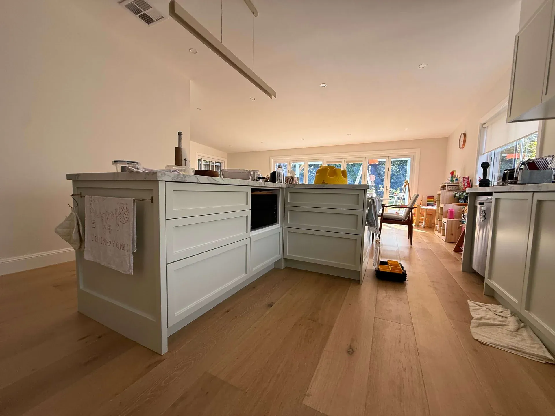 Willoughby kitchen renovation completed — full width showing island and cabinetry run