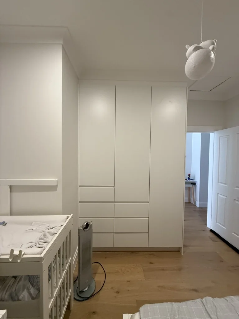 Willoughby white wardrobe with drawers below — bedroom with pendant light
